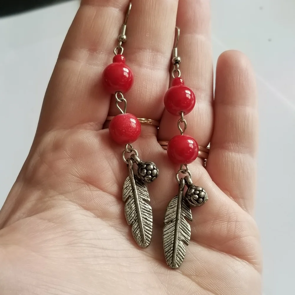 Feather earrings with red beads and flower ball beads silver tone boho